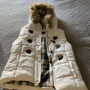 White puffy vest with fur hood